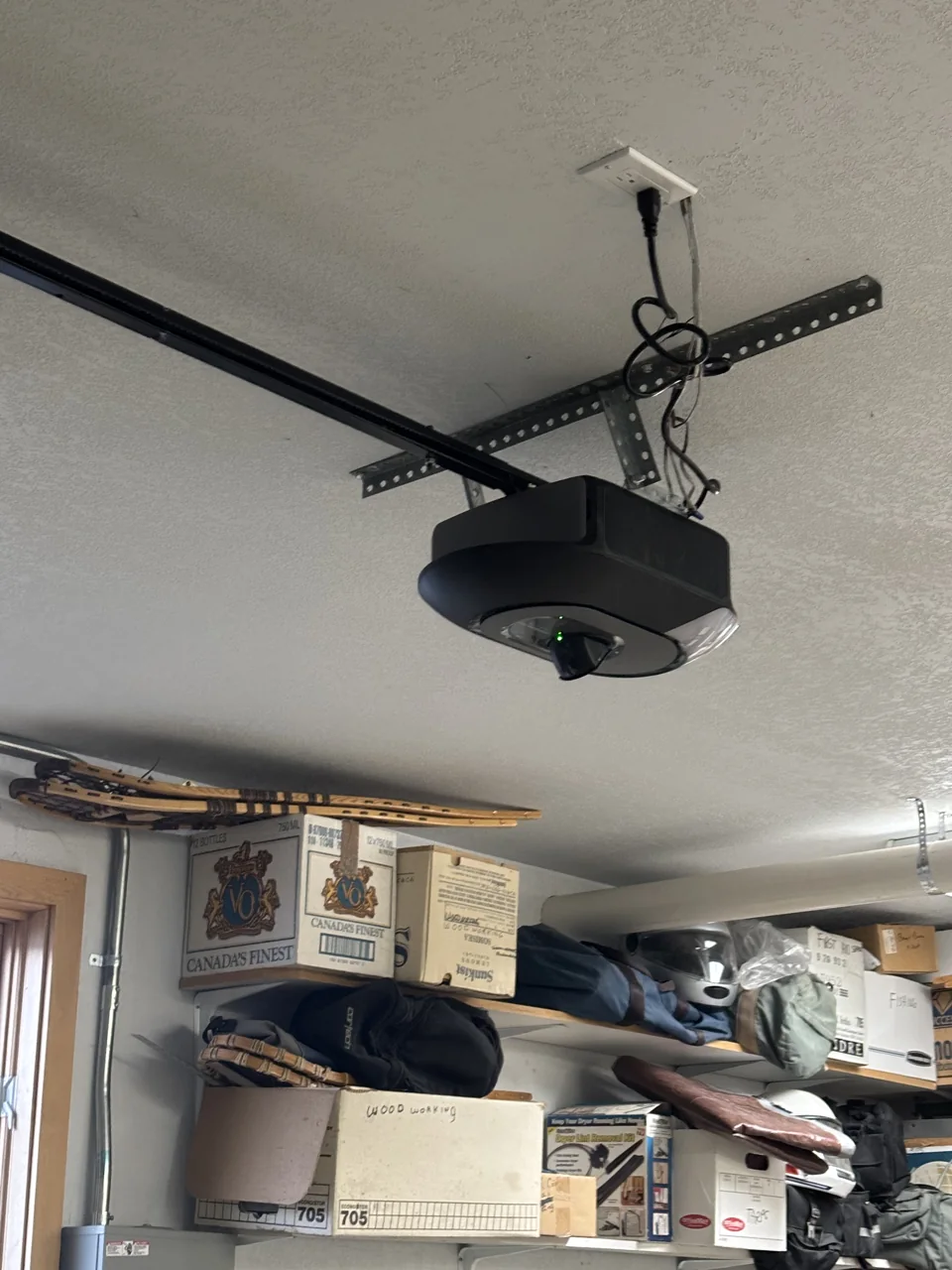 Ceiling-mounted garage door opener and rail