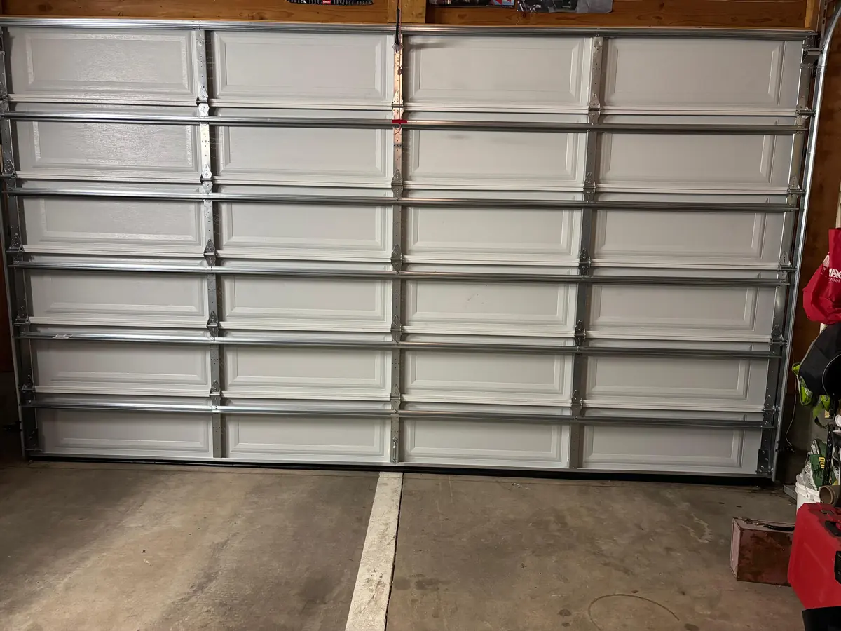 Interior view of a completed sectional garage door during a Lakewood service project in August 2026.