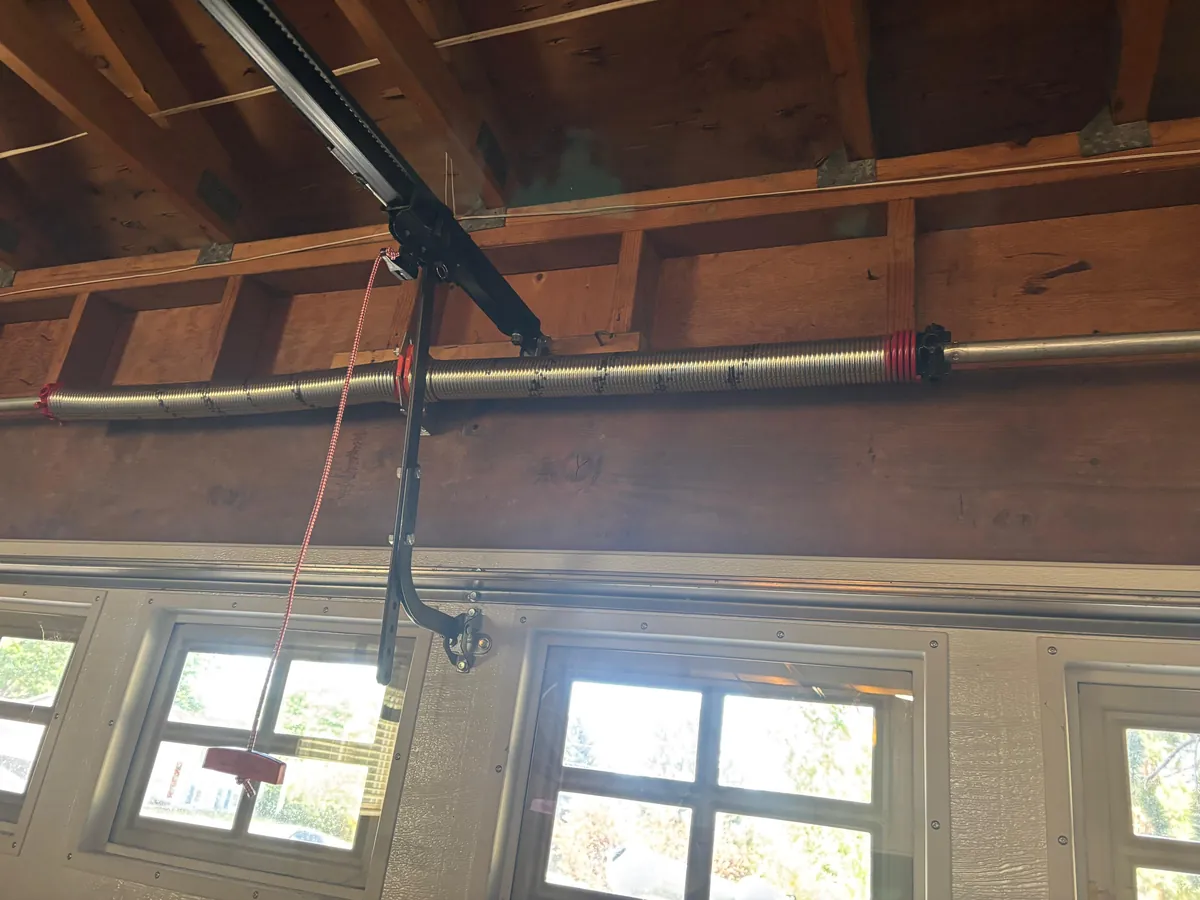 Completed dual torsion-spring assembly during a Golden garage door service job in November 2025.
