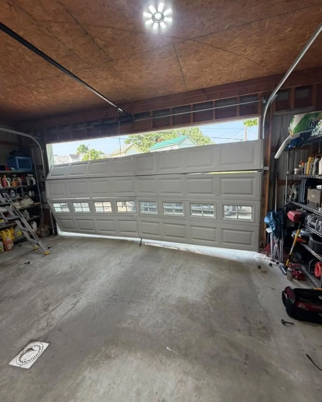 Lakewood garage door severely off track before its September 2026 repair